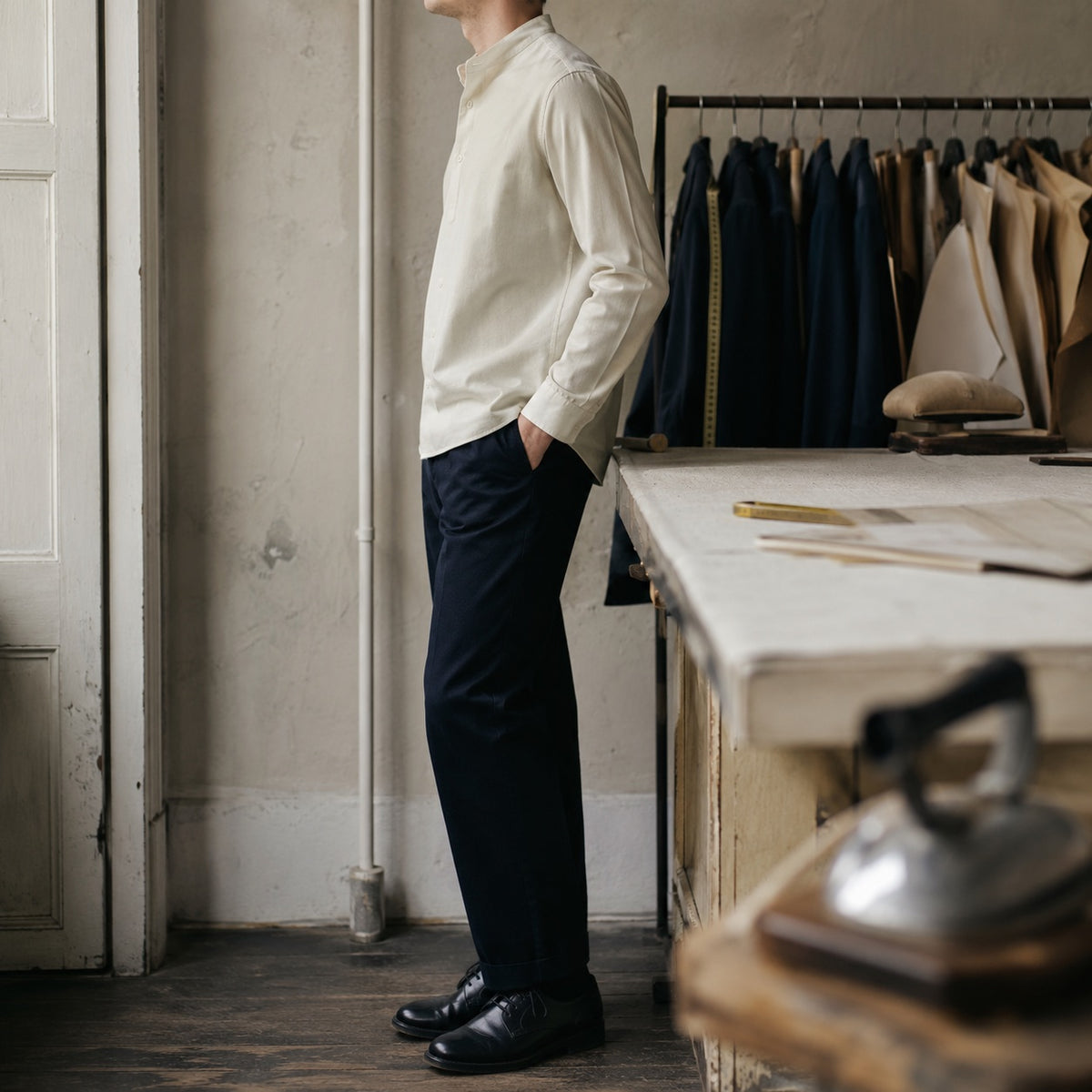 Bloomsbury grandad-collar tailored shirt — Tailored Shirts by CROWN TAILORING. shown on the model from the side.