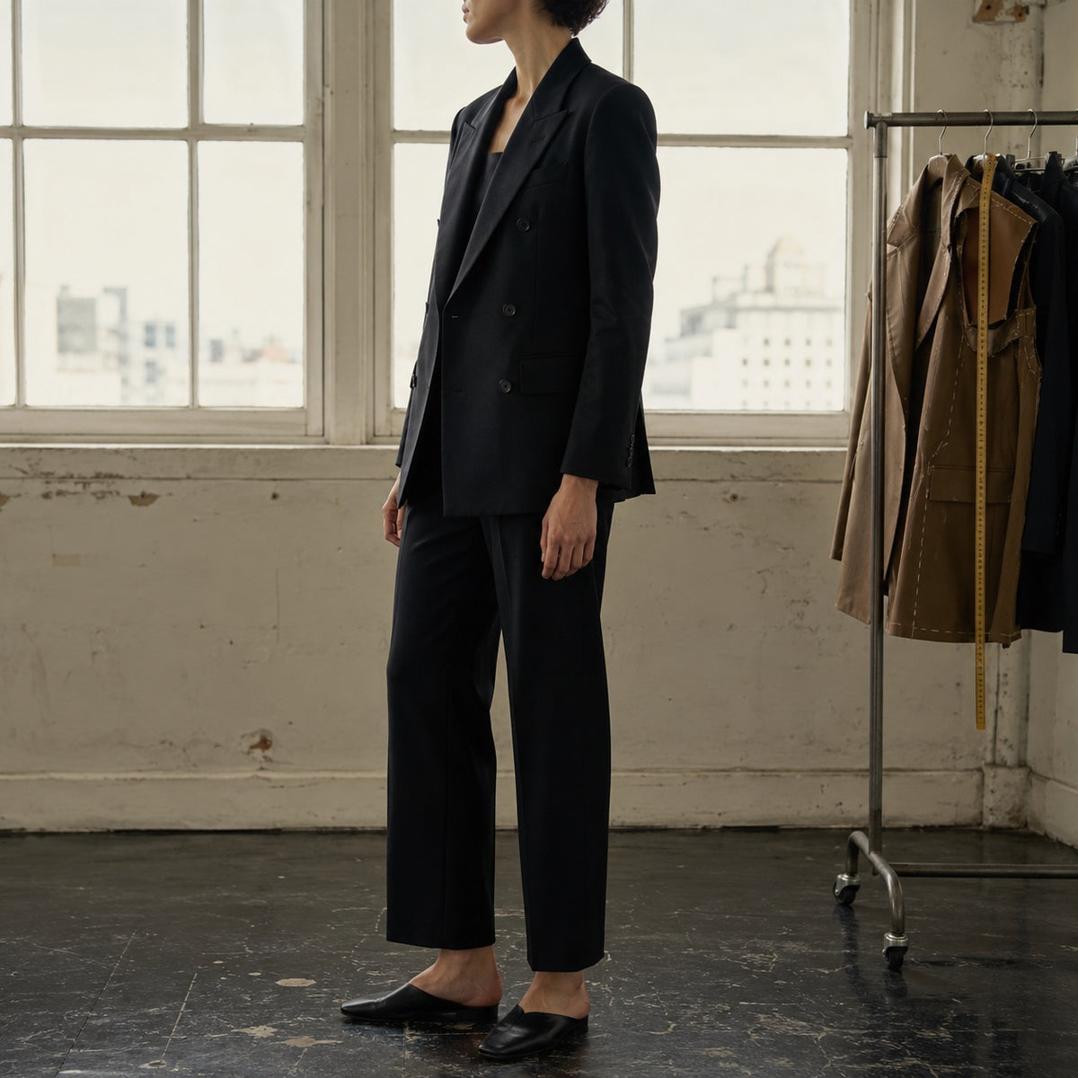 Clerkenwell double-breasted suit jacket — Suit Jackets by CROWN TAILORING. shown on the model from the side.