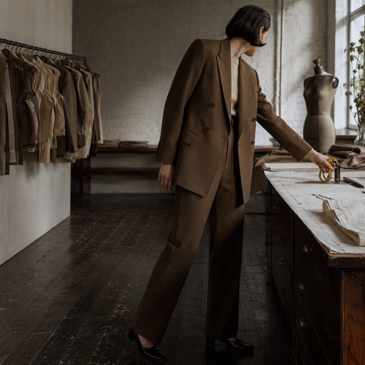 Pimlico double-breasted suit jacket — Suit Jackets by CROWN TAILORING. shown on the model from the side.