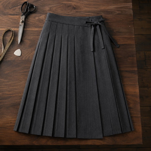 Clerkenwell box-pleated wrap skirt — Tailored Skirts by CROWN TAILORING. flat lay, front.