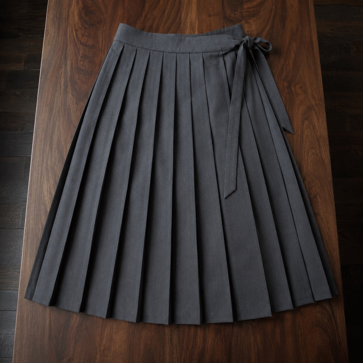 Bloomsbury box-pleated wrap skirt — Tailored Skirts by CROWN TAILORING. flat lay, front.
