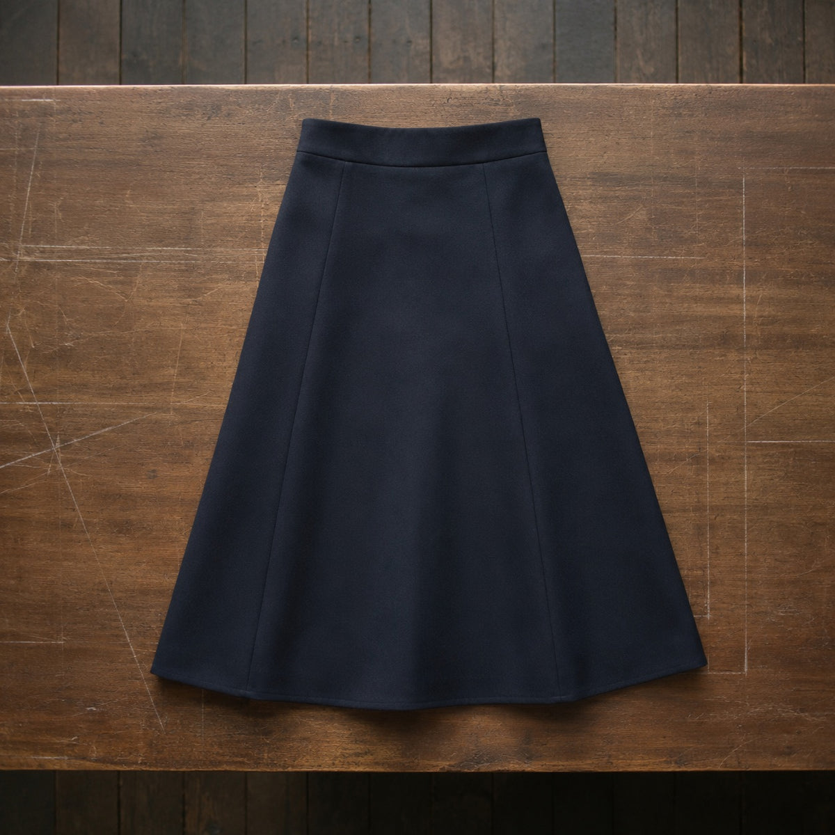 Marylebone A-line midi skirt — Tailored Skirts by CROWN TAILORING. flat lay, front.