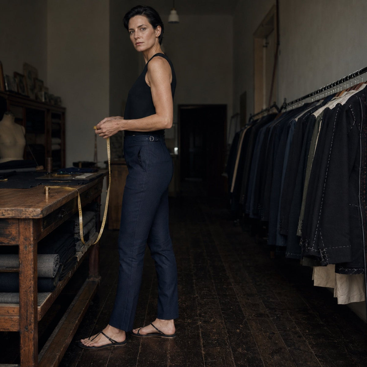 Holborn cigarette-leg tailored trousers — Tailored Trousers by CROWN TAILORING. shown on the model from the side.